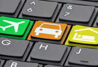 Keyboard image with car icon on one of the keys. Online Booking request for Premier Cars with Airport Runs to Gatwick, Heathrow, Southampton, Stanstead, Luton and Bournemouth from the Chichester West Sussex area